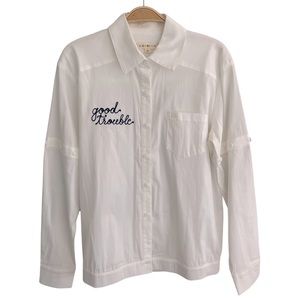 Kindom white button up shirt, hand embroidered “good trouble”